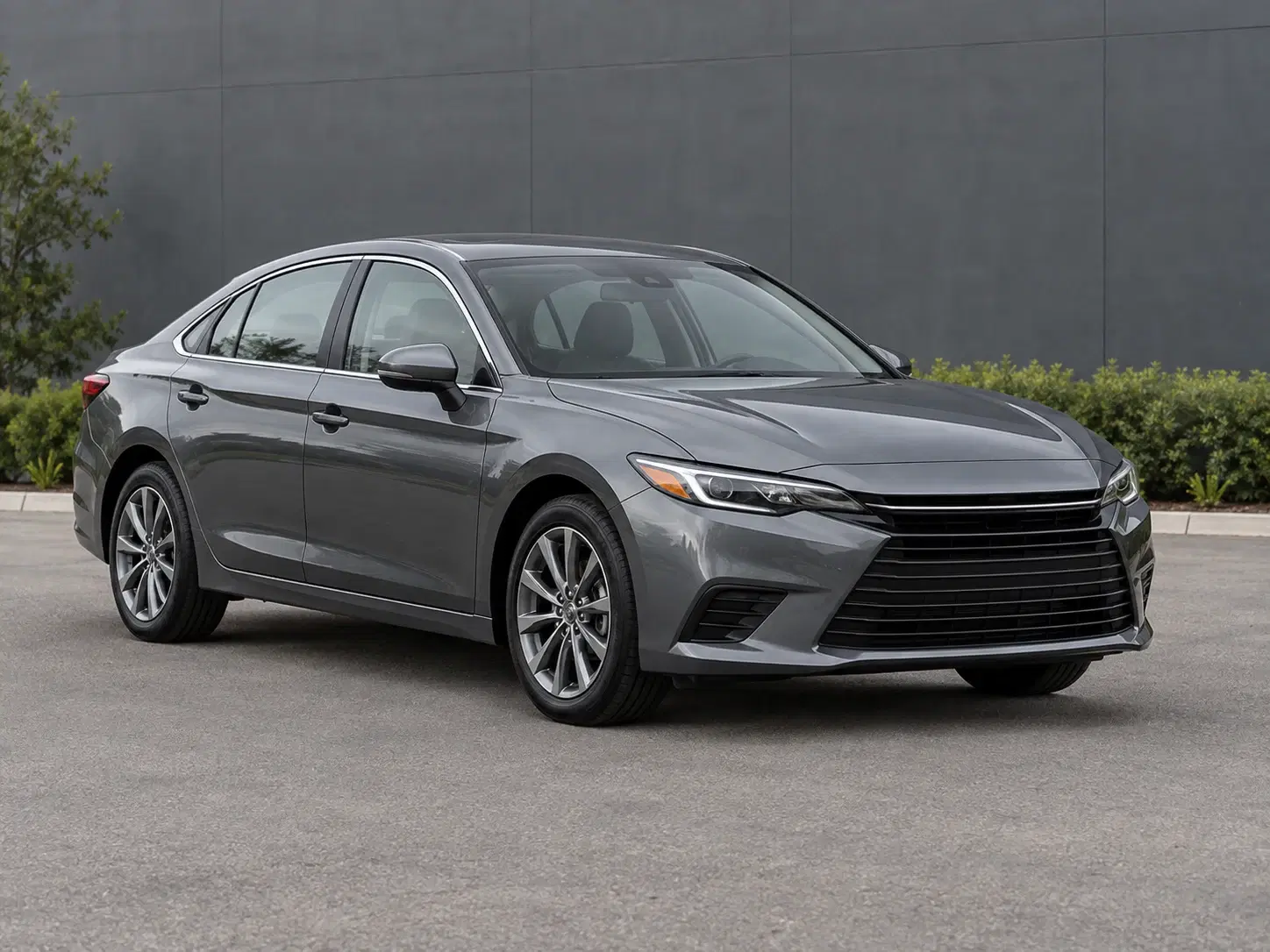 Clean graphite sedan photographed in full against a simple neutral background